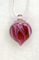 Red glass heart shaped piece of jewerly