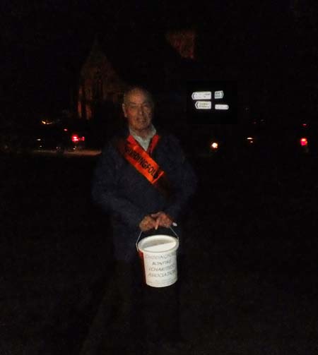 Man with charity collecting bucket