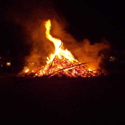 Bonfire burning tripod collapsed
