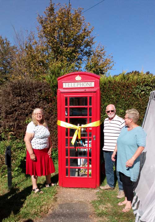 3 People Phone Box with Ribon round it
