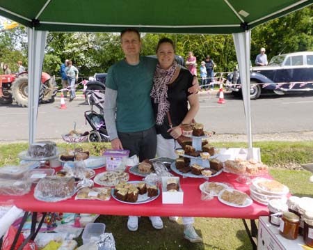 couple of people at cake stall