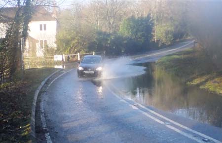 Car going through water at Anstead Brook