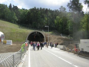 people walking out of tunnel viewed from front