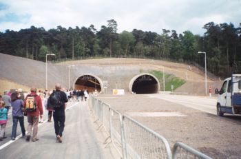 People walking into tunnel