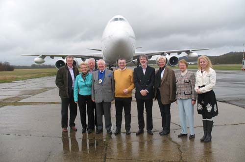 Group of people infront of aircraft