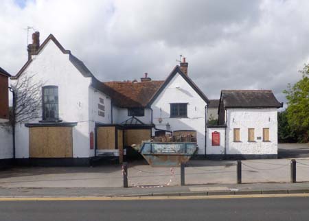 3 Lions   Scratchers   Farncombe   Boarded up with a skip outside 