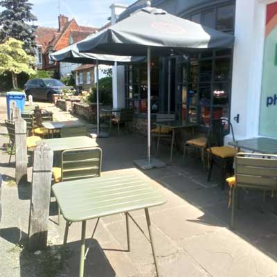 Tables and chairs outside coffee shop